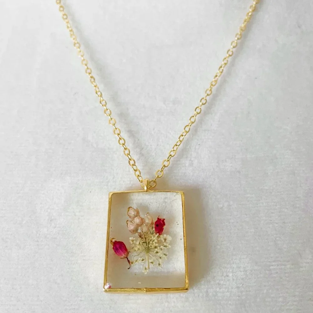 Pretty white and pink floral flower botanical resin necklace in gold bezel - Picture 2 of 3
